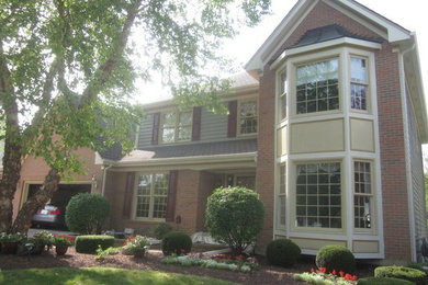 Inspiration for a two-story brick exterior home remodel in Chicago