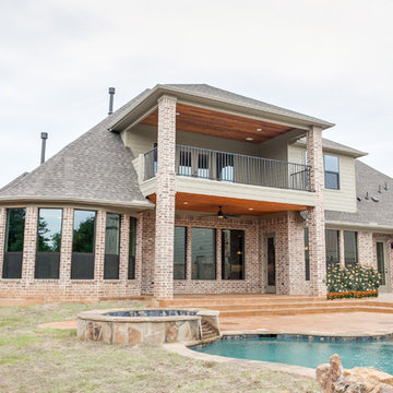 Traditional Brick Home with an Airplane Hanger