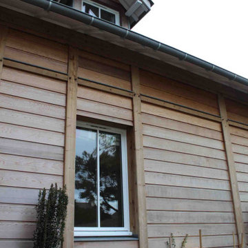 Construction Maison Bois au fond du jardin