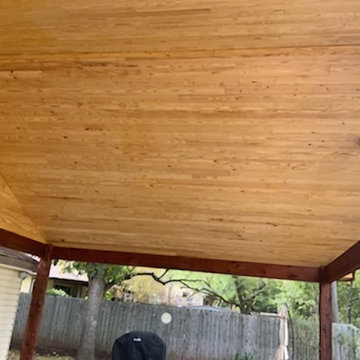Rough cedar pergola with tongue and groove ceiling