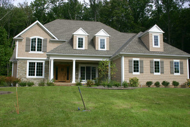 Example of a transitional exterior home design in Cleveland