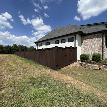 Dark Brown Composite Trex Fence and Black Iron Fence