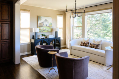 Example of a classic living room design in Denver with beige walls