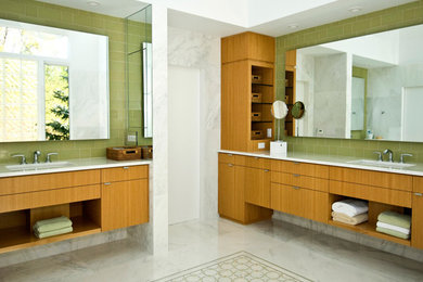 Inspiration for a large contemporary master white tile and stone slab marble floor bathroom remodel in New York with flat-panel cabinets, medium tone wood cabinets, an undermount sink and marble countertops