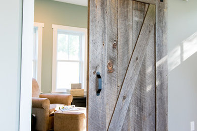 Home office - small farmhouse freestanding desk carpeted home office idea in Other with blue walls