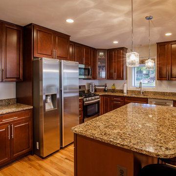 The cabinets are Cherry and countertops are Quartz.