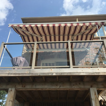 Retractable awning on 2nd level deck with Support Posts