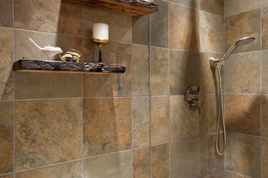 Inspiration for a mid-sized rustic multicolored tile and porcelain tile porcelain tile bathroom remodel in San Francisco with a vessel sink, furniture-like cabinets, medium tone wood cabinets, granite countertops, a one-piece toilet and multicolored walls