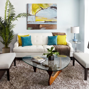 Idee per un piccolo soggiorno eclettico con pareti blu