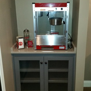 Large minimalist enclosed carpeted home theater photo in Kansas City with red walls