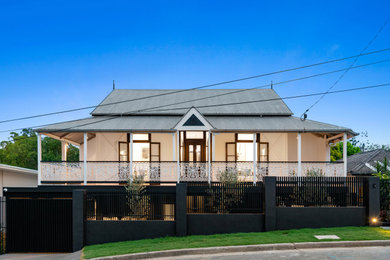 Inspiration for a large contemporary two-storey white house exterior in Brisbane with wood siding, a clipped gable roof, a metal roof, a grey roof and board and batten siding.