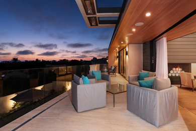 This is an example of a contemporary backyard patio in Orange County.