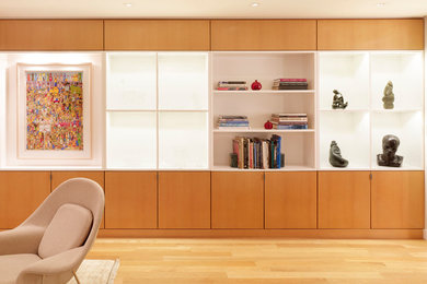 Living room - large modern enclosed light wood floor living room idea in New York with no fireplace and a wall-mounted tv