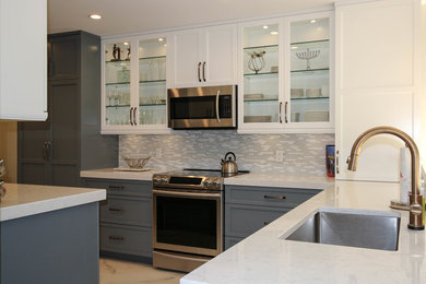 Inspiration for a mid-sized contemporary l-shaped marble floor eat-in kitchen remodel in Miami with an undermount sink, shaker cabinets, gray cabinets, quartzite countertops, multicolored backsplash, glass tile backsplash, stainless steel appliances and a peninsula