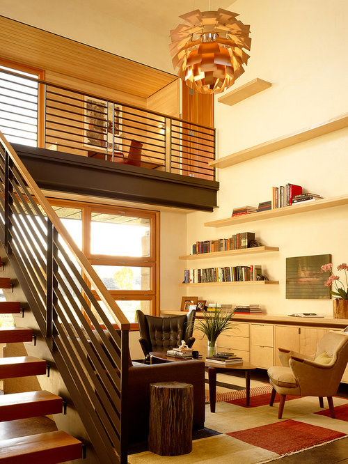 Modern home office idea in Jackson with white walls and dark hardwood floors Modern Home Office Jackson Modern Home Office Jackson Modern home office idea in Jackson with white walls and dark hardwood floors