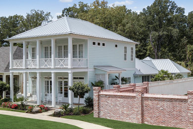 Example of a transitional home design design in New Orleans