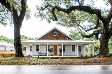 Mid-sized transitional blue one-story exterior home photo in Charleston with a metal roof and a gray roof
