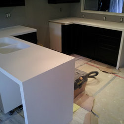 Corian Glacier White Kitchen with Matching Sink and Waterfall Siding - Products