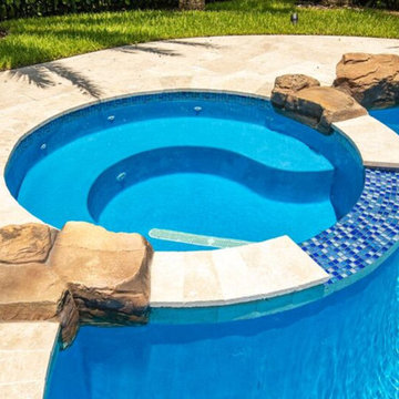 Custom Spa Freeform Custom Pool with Rock Waterfall in Parkland, Florida