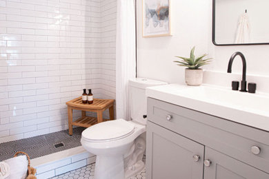 Small country master white tile and porcelain tile porcelain tile, white floor and single-sink shower curtain photo in Orlando with gray cabinets, a one-piece toilet, gray walls, quartzite countertops, white countertops and a freestanding vanity