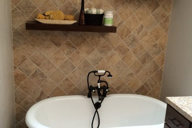 Freestanding bathtub - mid-sized traditional master brown tile and ceramic tile ceramic tile and beige floor freestanding bathtub idea in New York with flat-panel cabinets, dark wood cabinets, brown walls and granite countertops