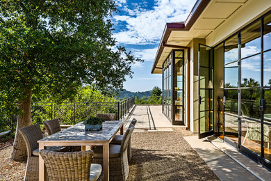 Patio - mediterranean gravel patio idea in Santa Barbara with no cover