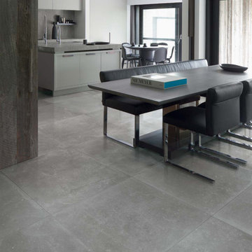 Modern kitchen and dining room with grey porcelain tile