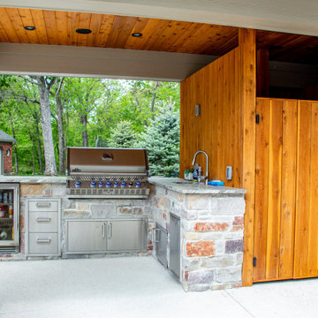 Covered Patio with an Outdoor Kitchen area and Fireplace Area