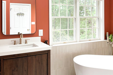 Bathroom - mid-sized master white tile and stone tile white floor and double-sink bathroom idea in DC Metro with flat-panel cabinets, brown cabinets, a two-piece toilet, an undermount sink, solid surface countertops, a hinged shower door, white countertops and a freestanding vanity