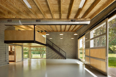 Example of a mid-sized trendy three-car garage workshop design in Philadelphia