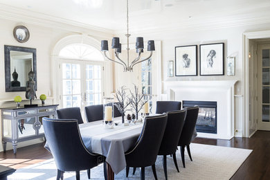 Elegant coffered ceiling dining room photo in Other with a wood fireplace surround