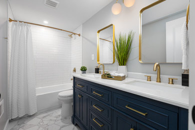 Mid-sized kids' white tile and ceramic tile ceramic tile, white floor and double-sink bathroom photo in Other with recessed-panel cabinets, blue cabinets, a one-piece toilet, gray walls, a drop-in sink, quartz countertops, white countertops and a freestanding vanity