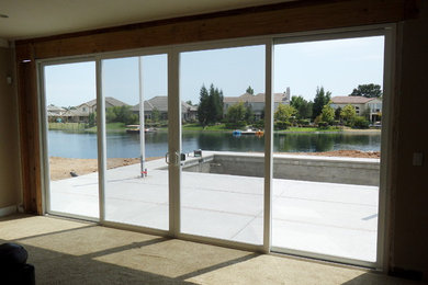 Example of a large carpeted hallway design in Sacramento with beige walls