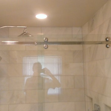 BATHROOM - Calcutta Gold Marble Shower / Gray Penny Tile Floor