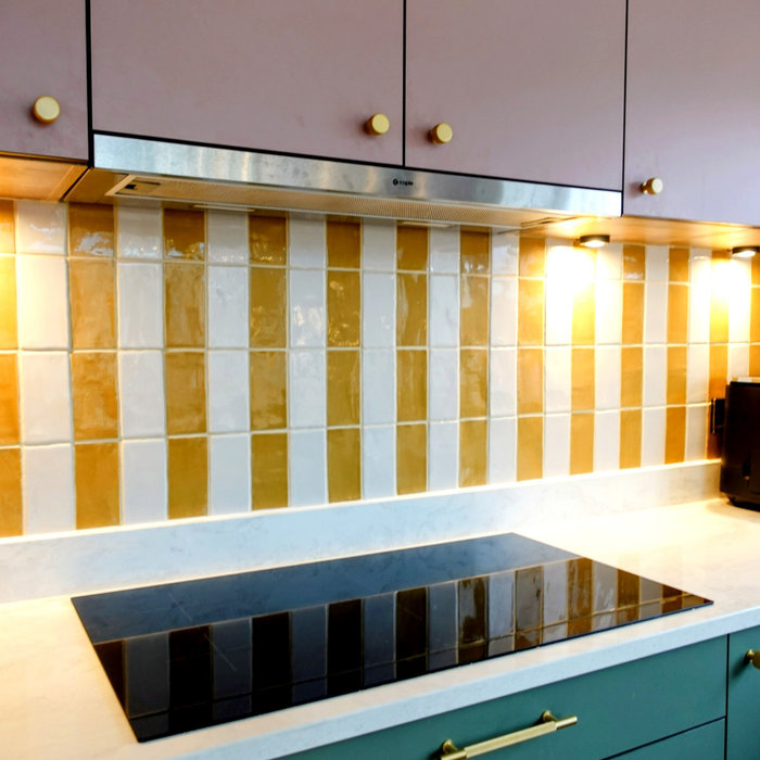 Example of a mid-sized danish u-shaped medium tone wood floor and brown floor open concept kitchen design in Other with a farmhouse sink, flat-panel cabinets, distressed cabinets, quartzite countertop