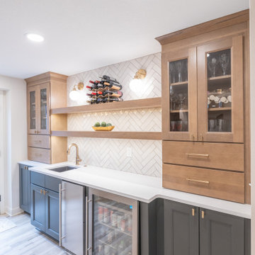 Warm & Inviting Basement Retreat with Custom Bar + Entertainment Center