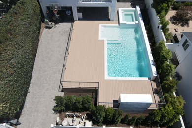 Inspiration for a contemporary pool remodel in Orange County