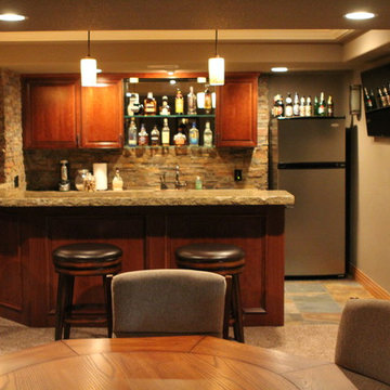Eye-popping Denver Basement Remodel with hidden bookcase doors and tray ceilings
