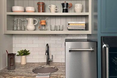 Mid-sized cottage wet bar photo in Austin with an undermount sink, recessed-panel cabinets, blue cabinets, granite countertops, white backsplash and subway tile backsplash