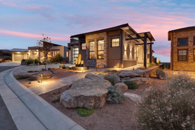 Inspiration for a small contemporary brown one-story mixed siding house exterior remodel in Other with a hip roof and a tile roof
