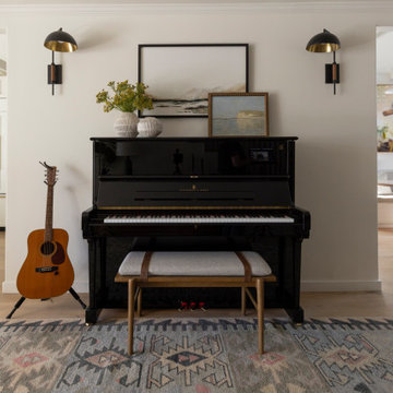 Entryway Feature Wall with Upright Piano, Bench Seating, and Accent Sconces
