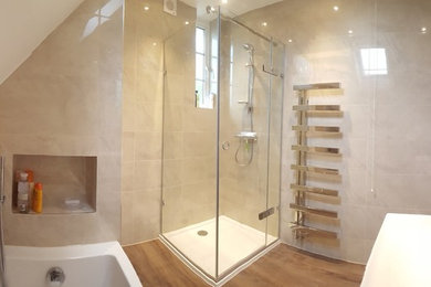 Large contemporary family bathroom in London with a wall-mounted sink and a hinged door.