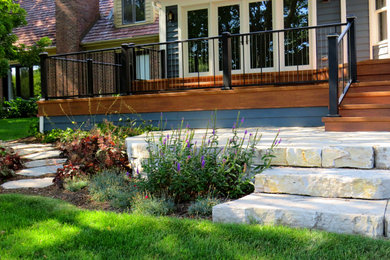Inspiration for a large contemporary backyard patio in Chicago with decking and no cover.