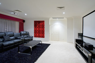 Home theater - traditional home theater idea in Charlotte