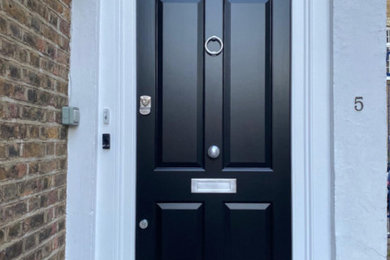Photo of an entrance in London with a single front door and a black front door.