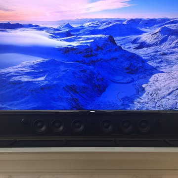 Recessed TV & Custom Soundbar over fireplace