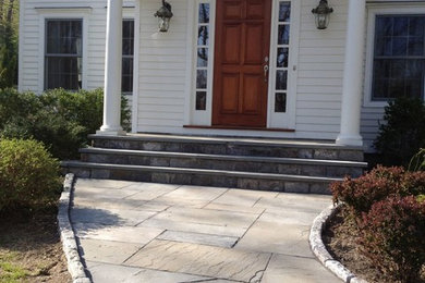 Example of a mid-sized classic white two-story wood house exterior design in New York