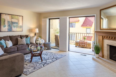 Small beach style formal and enclosed ceramic tile living room photo in Los Angeles with beige walls, a corner fireplace, a wood fireplace surround and no tv