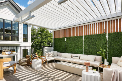 Example of a mid-sized trendy rooftop rooftop metal railing outdoor kitchen deck design in Chicago with a pergola