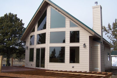 Mid-sized two-story concrete fiberboard exterior home photo in Portland
